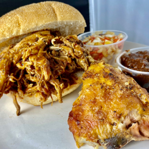 Pulled pork sandwich and Chicken leg with BBQ Sauce and Coleslaw
